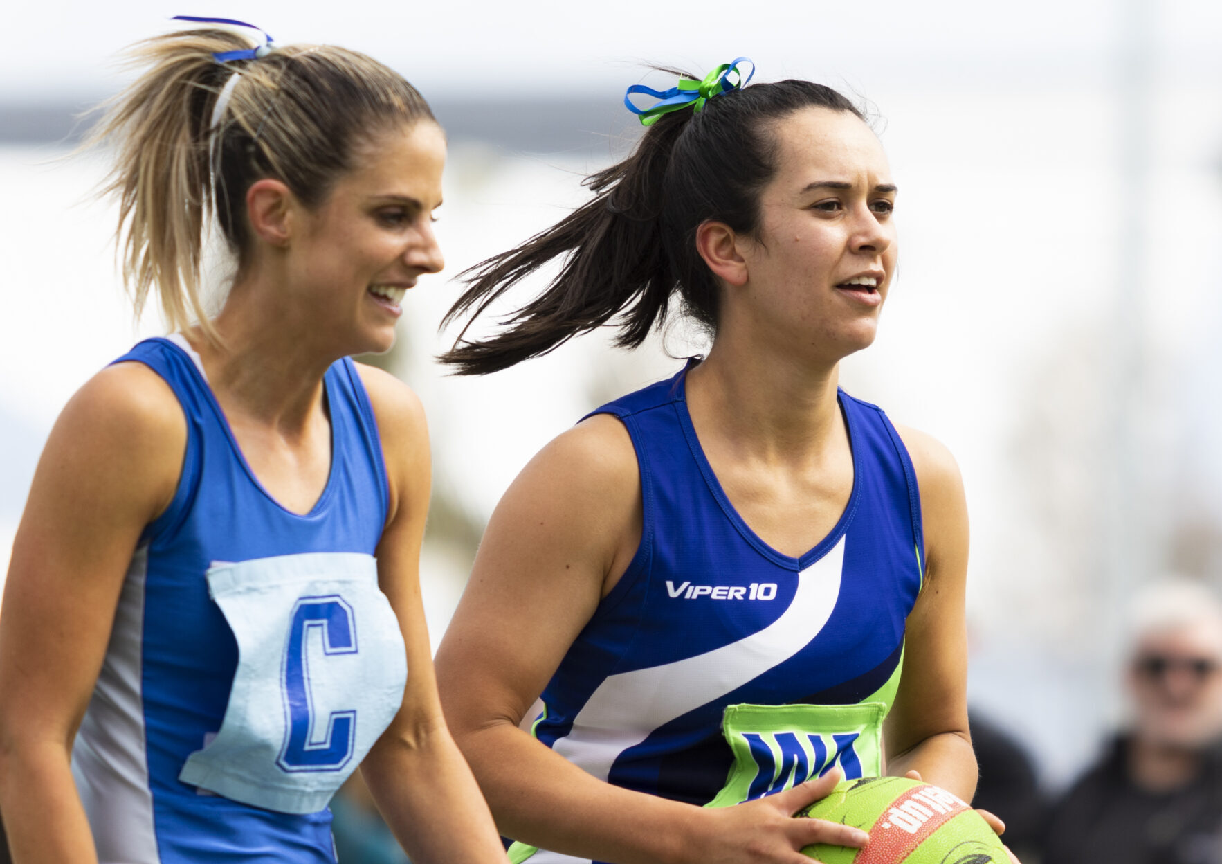 Two Women standing during a netball game