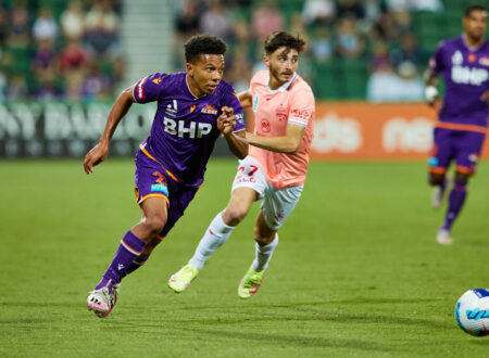 Perth Glory player chasing after ball - soccer