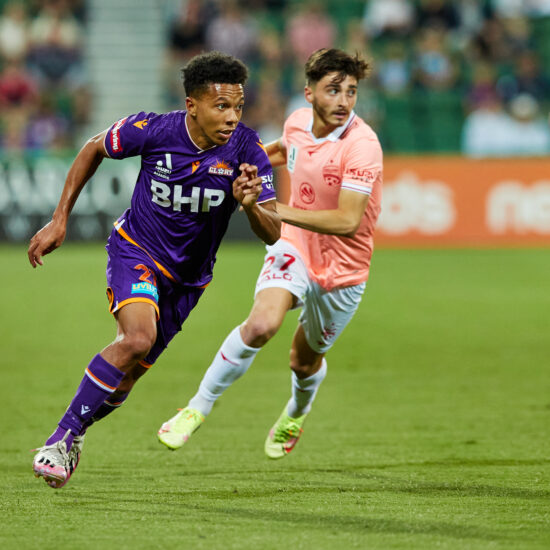 Perth Glory player chasing after ball - soccer