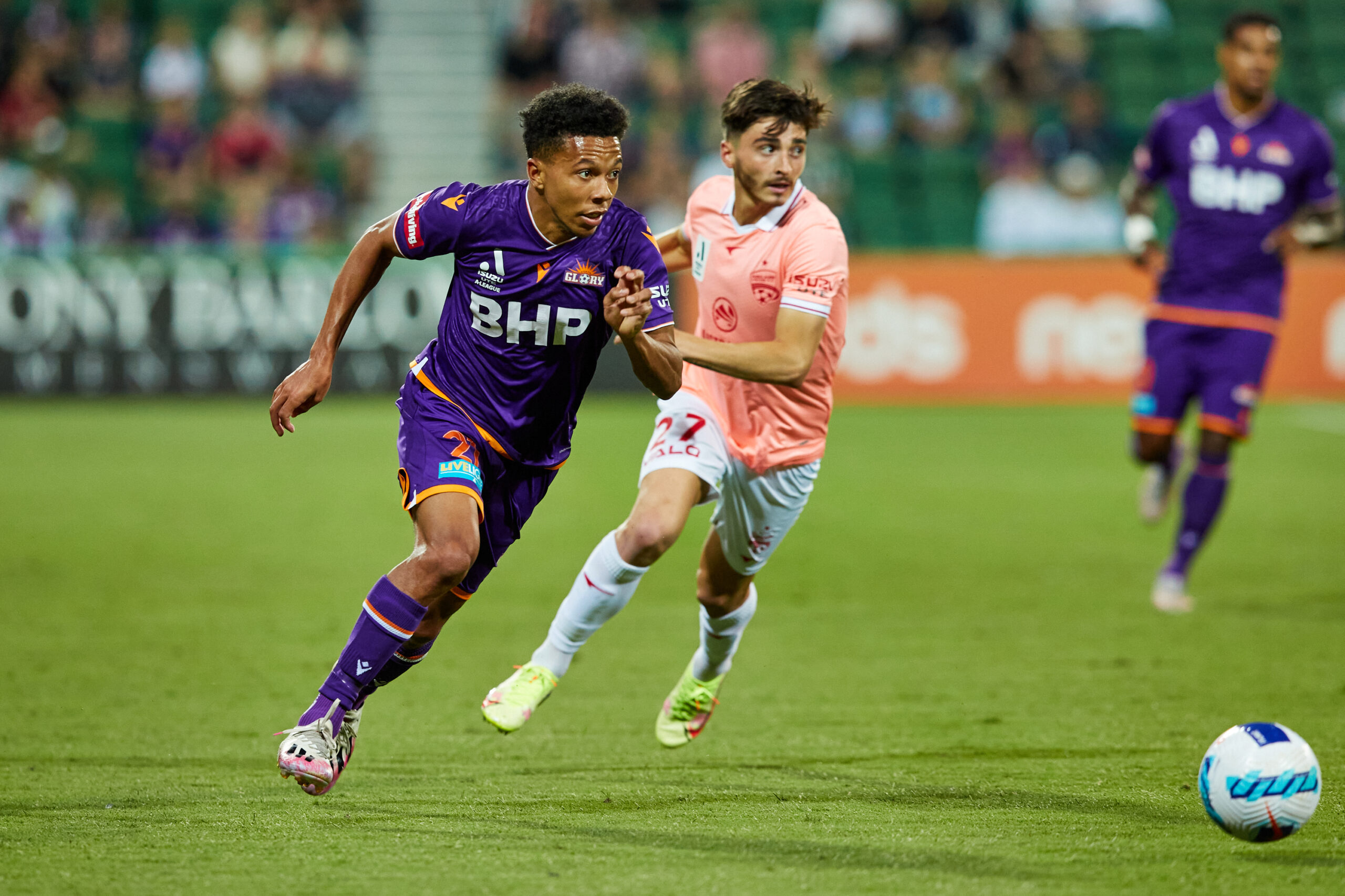 Perth Glory player chasing after ball - soccer